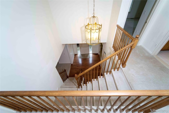 6169 Valley View Dr, Canton, MI 48187 - staircase with a chandelier and baseboards
