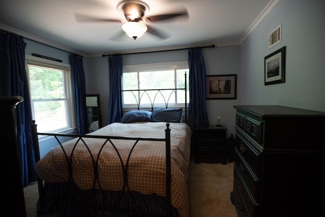1204 Bydding Rd, Ann Arbor, MI 48103 - carpeted bedroom featuring multiple windows, crown molding, and a ceiling fan