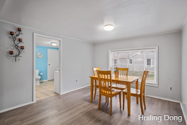 45 S Park St, Muskegon, MI 49442 - dining room featuring crown molding, wood finished floors, and baseboards