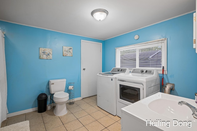 45 S Park St, Muskegon, MI 49442 - laundry room featuring independent washer and dryer, light tile patterned floors, and baseboards