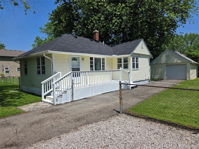3263 Beechwood St, Monroe, MI 48162 - view of front of property with covered porch, asphalt driveway, a garage, and roof with shingles