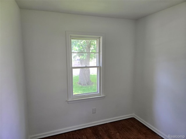 3263 Beechwood St, Monroe, MI 48162 - empty room featuring healthy amount of natural light and dark wood-style floors