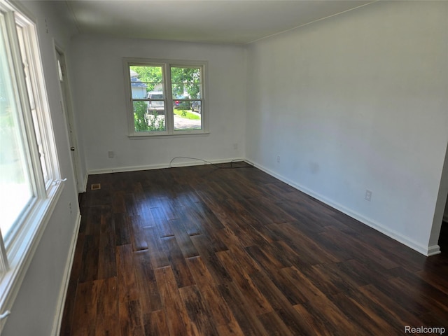 3263 Beechwood St, Monroe, MI 48162 - spare room with dark wood-style floors and baseboards