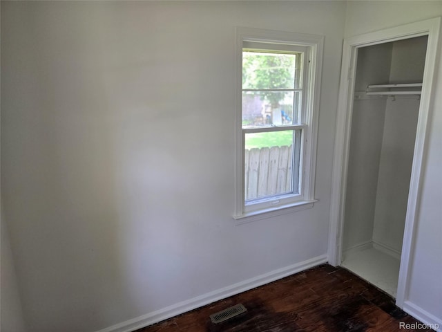 3263 Beechwood St, Monroe, MI 48162 - unfurnished bedroom with dark wood-style floors and a closet