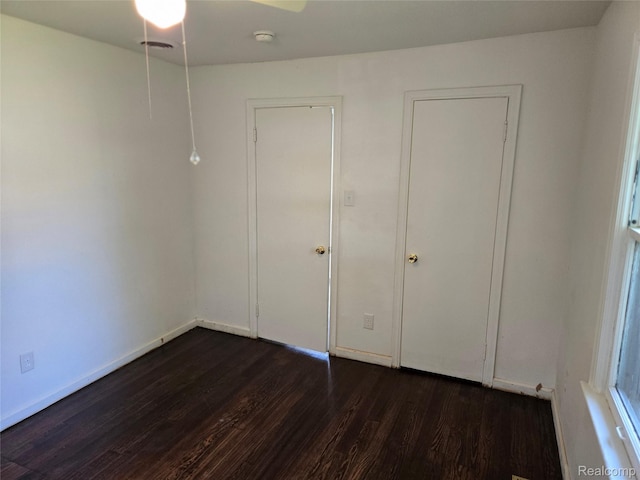 3263 Beechwood St, Monroe, MI 48162 - unfurnished bedroom featuring dark wood-style floors and baseboards