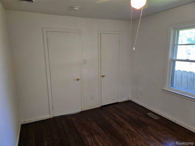 3263 Beechwood St, Monroe, MI 48162 - unfurnished bedroom featuring dark wood-style floors and baseboards