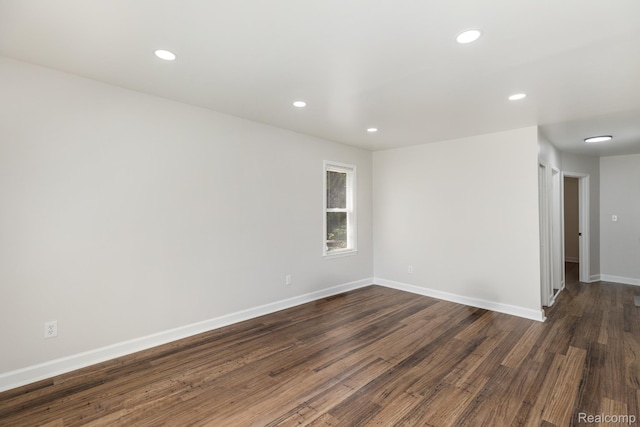 17877 Rowe St, Detroit, MI 48205 - spare room featuring dark wood-style flooring, recessed lighting, and baseboards