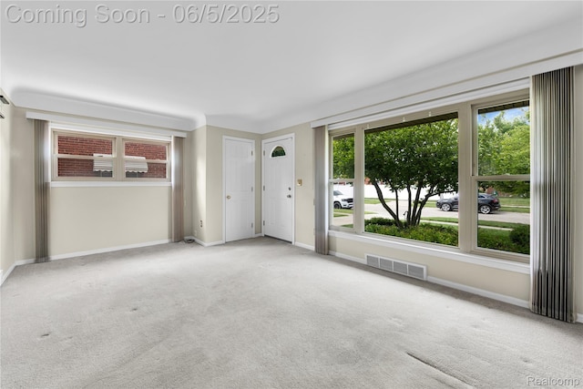 7639 Polk St, Taylor, MI 48180 - unfurnished living room with carpet flooring and baseboards