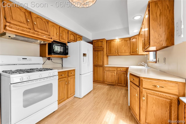 7639 Polk St, Taylor, MI 48180 - kitchen featuring white appliances, light wood-style floors, brown cabinetry, custom range hood, and light countertops