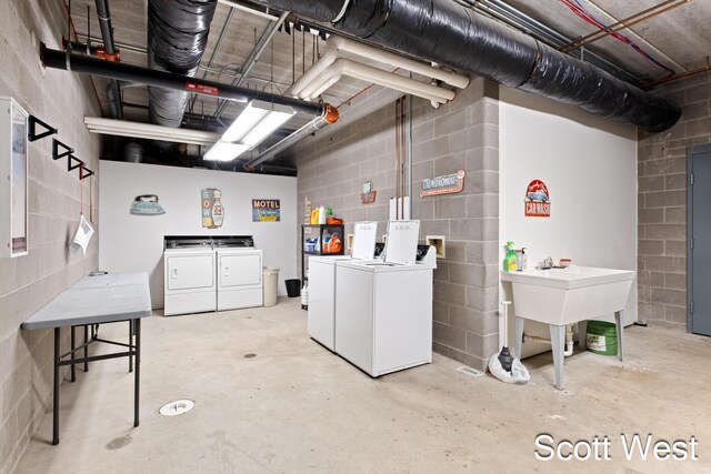 801 Monroe Ave NW Unit 402, Grand Rapids, MI 49503 - below grade area featuring washer and clothes dryer and concrete block wall