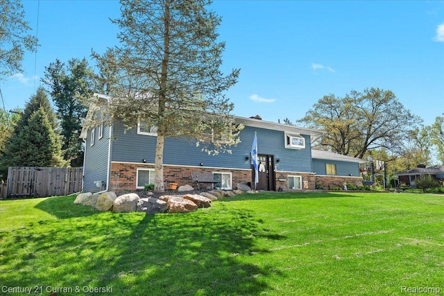 2566 Marchar Dr, Wolverine Lake, MI 48390 - back of house with brick siding