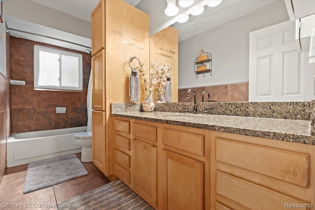 2566 Marchar Dr, Wolverine Lake, MI 48390 - full bath featuring toilet, vanity, tile patterned floors, and tub / shower combination