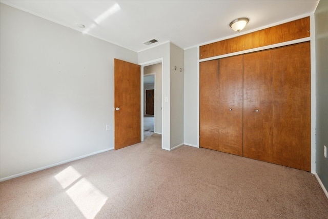 2910 Elizabeth St, Wayne, MI 48184 - unfurnished bedroom with light carpet, a closet, and baseboards
