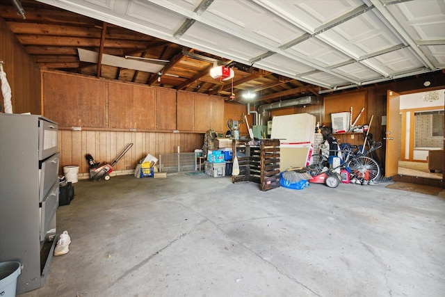 2910 Elizabeth St, Wayne, MI 48184 - garage with wooden walls and a garage door opener