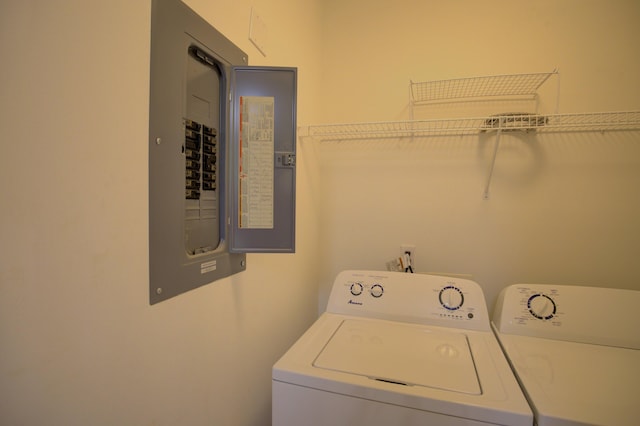 920 Oakbrook Dr, Jackson, MI 49203 - washroom featuring electric panel and washer and dryer
