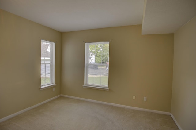 920 Oakbrook Dr, Jackson, MI 49203 - unfurnished room featuring light colored carpet and baseboards