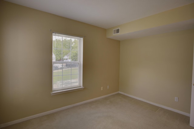 920 Oakbrook Dr, Jackson, MI 49203 - unfurnished room with light colored carpet and baseboards