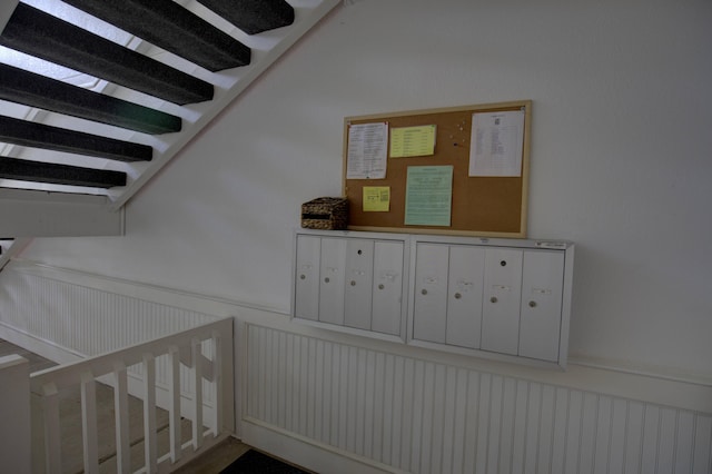 920 Oakbrook Dr, Jackson, MI 49203 - stairs featuring mail area and wainscoting