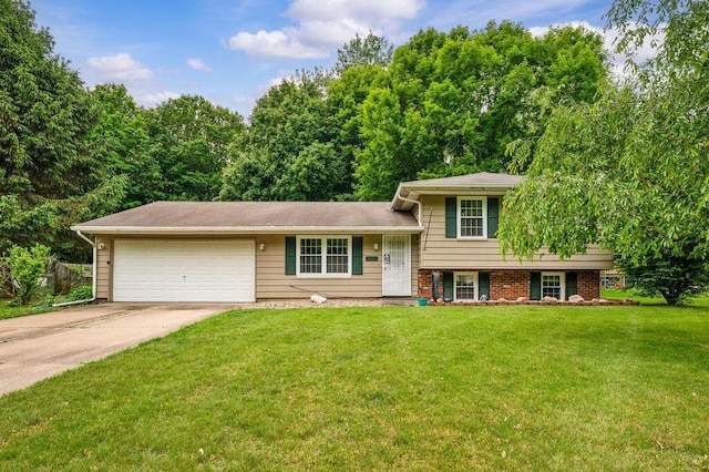 917 Kensington Dr, Niles, MI 49120 - split level home with concrete driveway, an attached garage, and a front yard