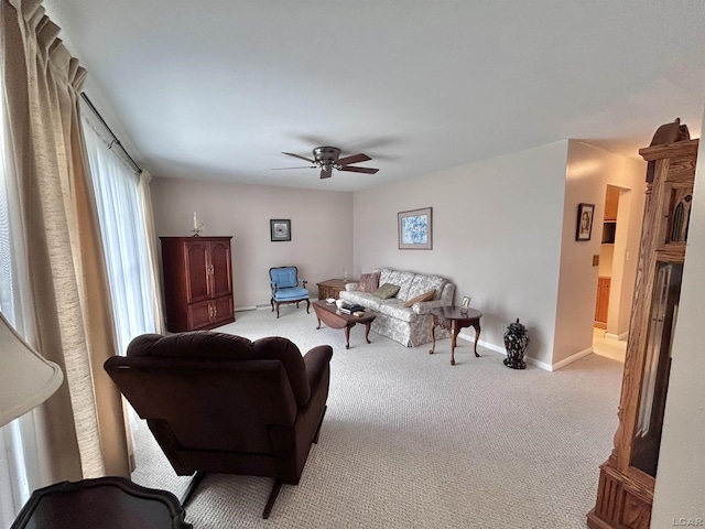 818 W Chestnut St, Morenci, MI 49256 - living room featuring carpet, a ceiling fan, and baseboards