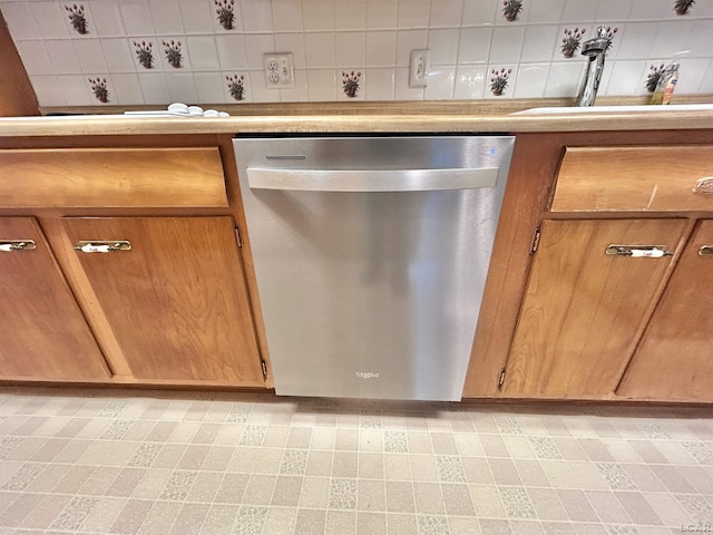 818 W Chestnut St, Morenci, MI 49256 - kitchen featuring dishwasher, a sink, brown cabinetry, light countertops, and backsplash