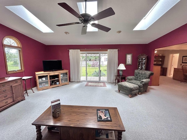 818 W Chestnut St, Morenci, MI 49256 - living area featuring a skylight, vaulted ceiling, carpet flooring, and healthy amount of natural light