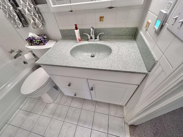 818 W Chestnut St, Morenci, MI 49256 - bathroom with toilet, vanity, tile patterned flooring, and backsplash