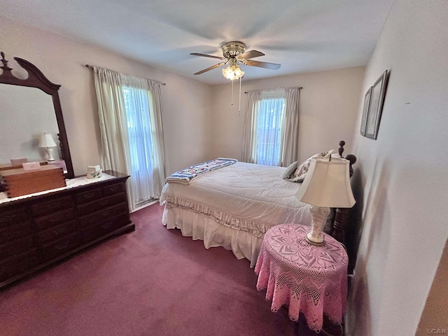 818 W Chestnut St, Morenci, MI 49256 - bedroom with dark colored carpet and a ceiling fan