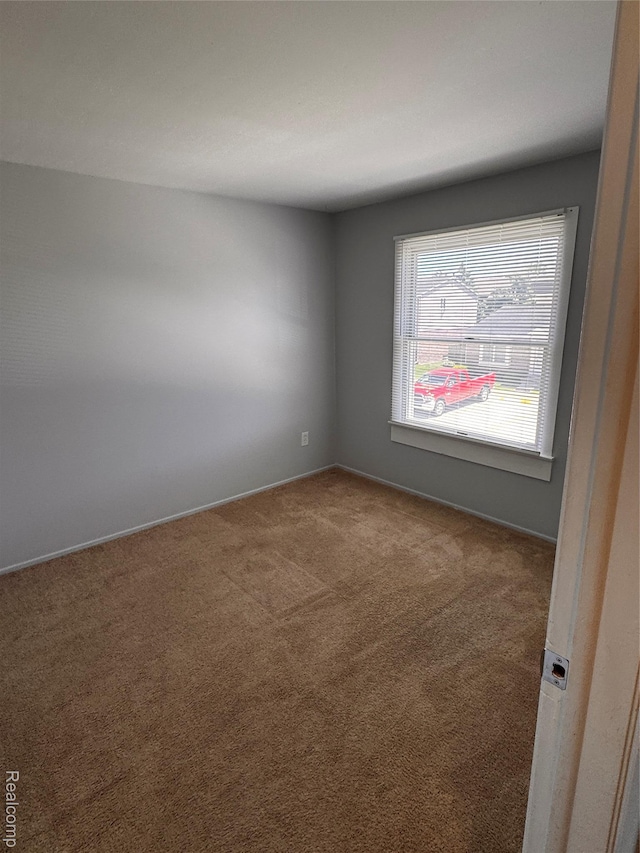 37263 Great Oaks Ct, Clinton Township, MI 48036 - carpeted spare room featuring baseboards