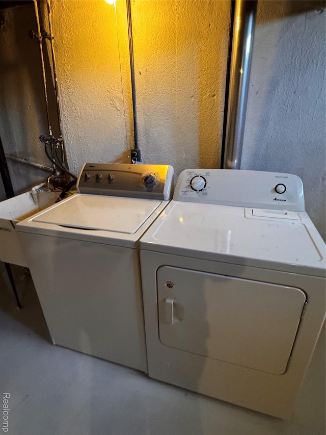 37263 Great Oaks Ct, Clinton Township, MI 48036 - laundry room with a textured wall and washing machine and clothes dryer