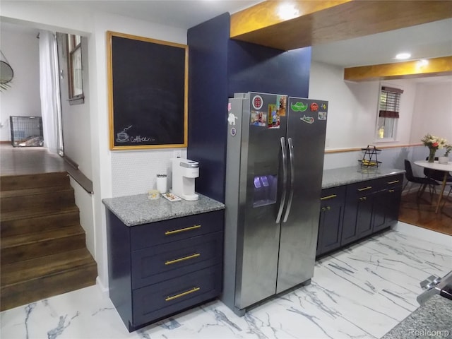 9207 Whitall Ln, Trenton, MI 48138 - kitchen featuring stainless steel fridge, light marble finish floors, and light stone counters
