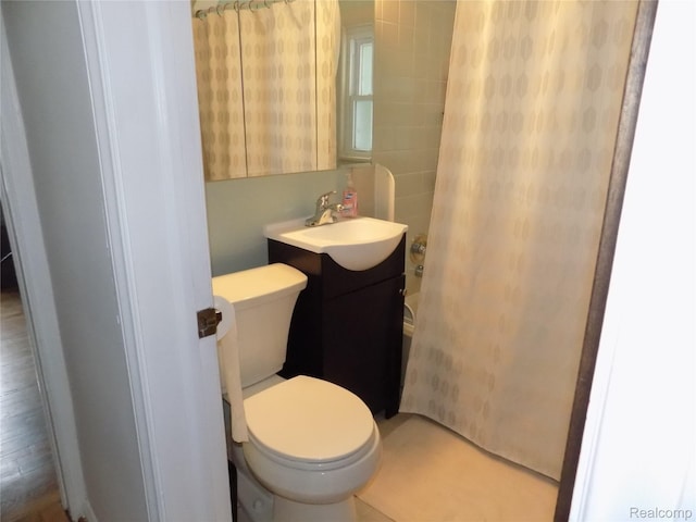 9207 Whitall Ln, Trenton, MI 48138 - bathroom with vanity, toilet, and tile walls
