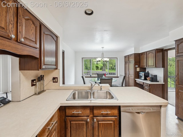4677 Rolling Ridge Rd, West Bloomfield, MI 48323 - kitchen featuring stainless steel dishwasher, a sink, a peninsula, and light countertops