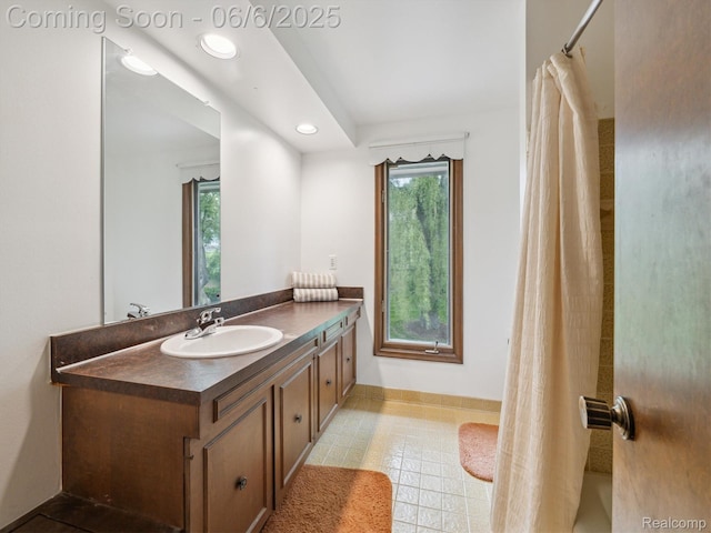 4677 Rolling Ridge Rd, West Bloomfield, MI 48323 - bathroom featuring vanity, plenty of natural light, recessed lighting, baseboards, and tile patterned floors