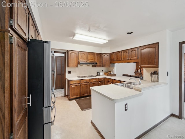 4677 Rolling Ridge Rd, West Bloomfield, MI 48323 - kitchen featuring a sink, appliances with stainless steel finishes, light countertops, a peninsula, and under cabinet range hood