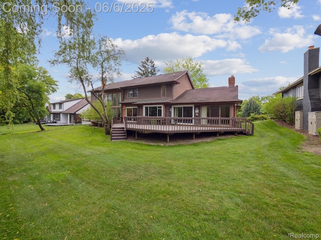 4677 Rolling Ridge Rd, West Bloomfield, MI 48323 - rear view of house featuring a chimney, a wooden deck, a lawn, and a sunroom