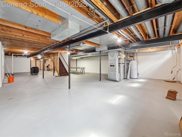 4677 Rolling Ridge Rd, West Bloomfield, MI 48323 - unfinished below grade area with stairs, heating unit, and gas water heater