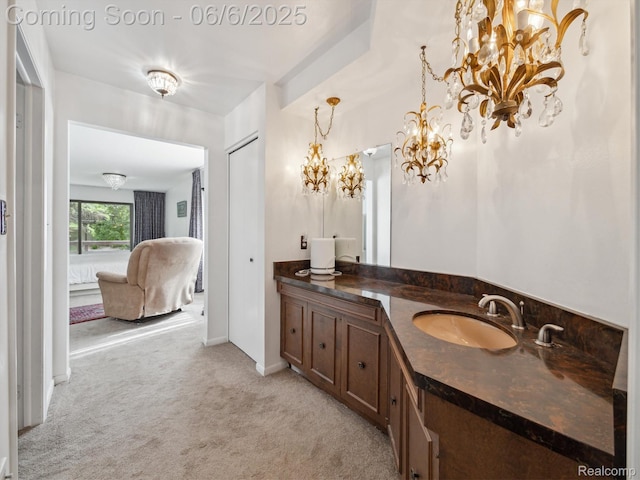 4677 Rolling Ridge Rd, West Bloomfield, MI 48323 - bathroom featuring vanity, a chandelier, baseboards, and connected bathroom