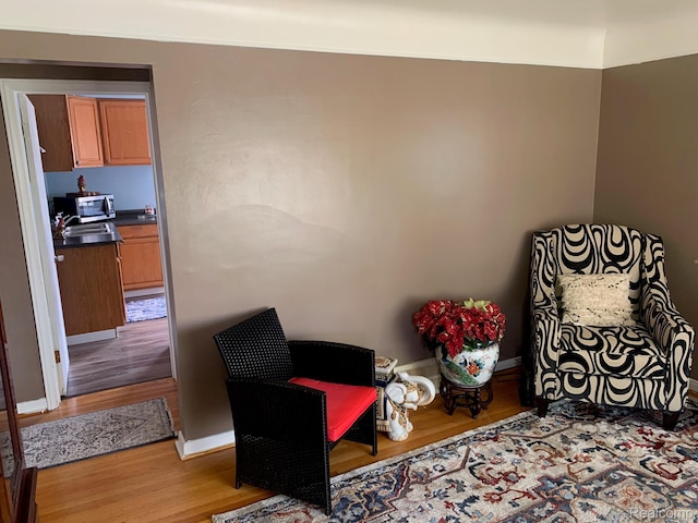 17439 Brody Ave, Allen Park, MI 48101 - sitting room featuring light wood-type flooring and baseboards