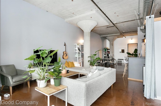 55 W Canfield Unit 210, Detroit, MI 48201 - living room featuring finished concrete floors and ornate columns