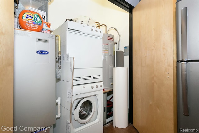 55 W Canfield Unit 210, Detroit, MI 48201 - washroom featuring stacked washing machine and dryer and water heater