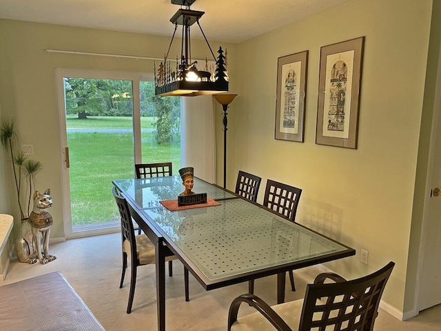 10439 Castaway Ct, Canadian Lakes, MI 49346 - dining room featuring carpet flooring and baseboards