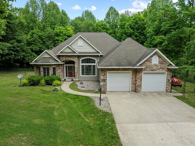 11082 Hoffman Rd, Marcellus, MI 49067 - view of front of house featuring stone siding, a garage, concrete driveway, and a shingled roof