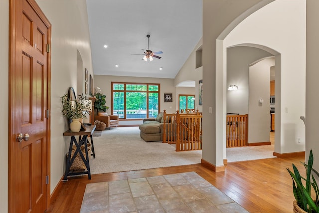 11082 Hoffman Rd, Marcellus, MI 49067 - entryway with a ceiling fan, light wood finished floors, arched walkways, high vaulted ceiling, and baseboards