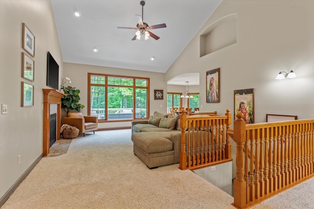 11082 Hoffman Rd, Marcellus, MI 49067 - carpeted living area featuring a ceiling fan, high vaulted ceiling, baseboards, a fireplace, and recessed lighting