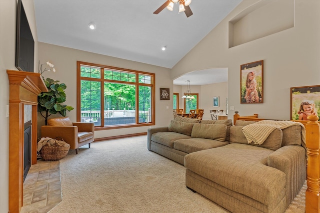 11082 Hoffman Rd, Marcellus, MI 49067 - living room with arched walkways, a fireplace with flush hearth, a ceiling fan, high vaulted ceiling, and recessed lighting