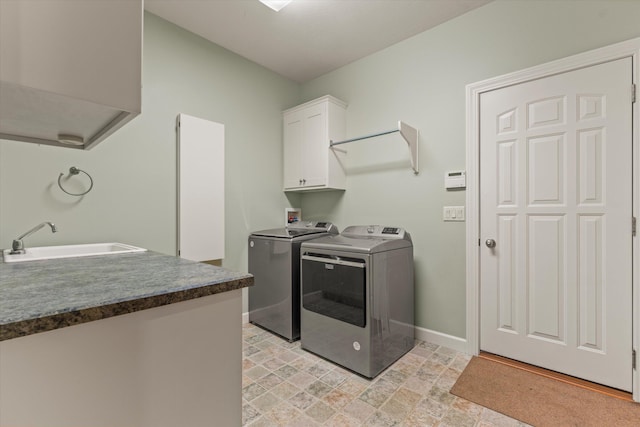 11082 Hoffman Rd, Marcellus, MI 49067 - washroom featuring cabinet space, washer and clothes dryer, and baseboards