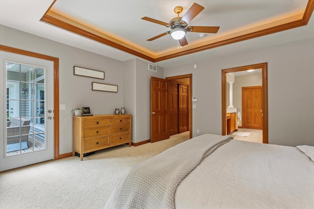 11082 Hoffman Rd, Marcellus, MI 49067 - bedroom featuring access to outside, a tray ceiling, light carpet, connected bathroom, and baseboards