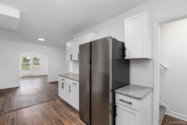 7505 E Robinwood St, Detroit, MI 48234 - kitchen featuring freestanding refrigerator, dark wood-style flooring, white cabinets, and tasteful backsplash