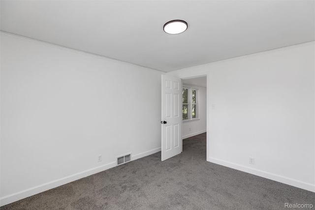 7505 E Robinwood St, Detroit, MI 48234 - empty room featuring carpet floors, baseboards, and ornamental molding